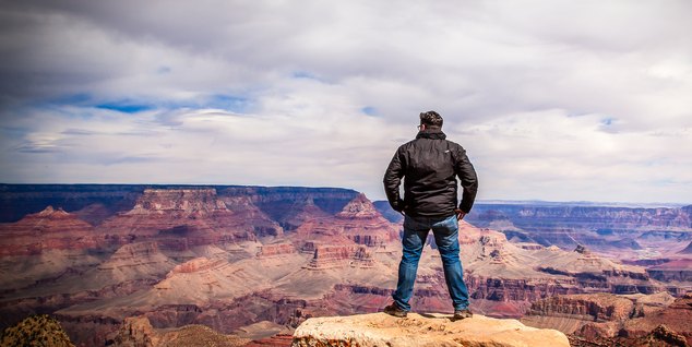 Hiker looking out over the Grand Canyon